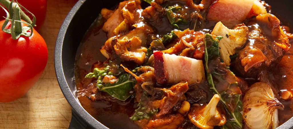 Autumn casserole with bacon, black kale and chanterelles Autumn casserole with bacon, black kale and chanterelles