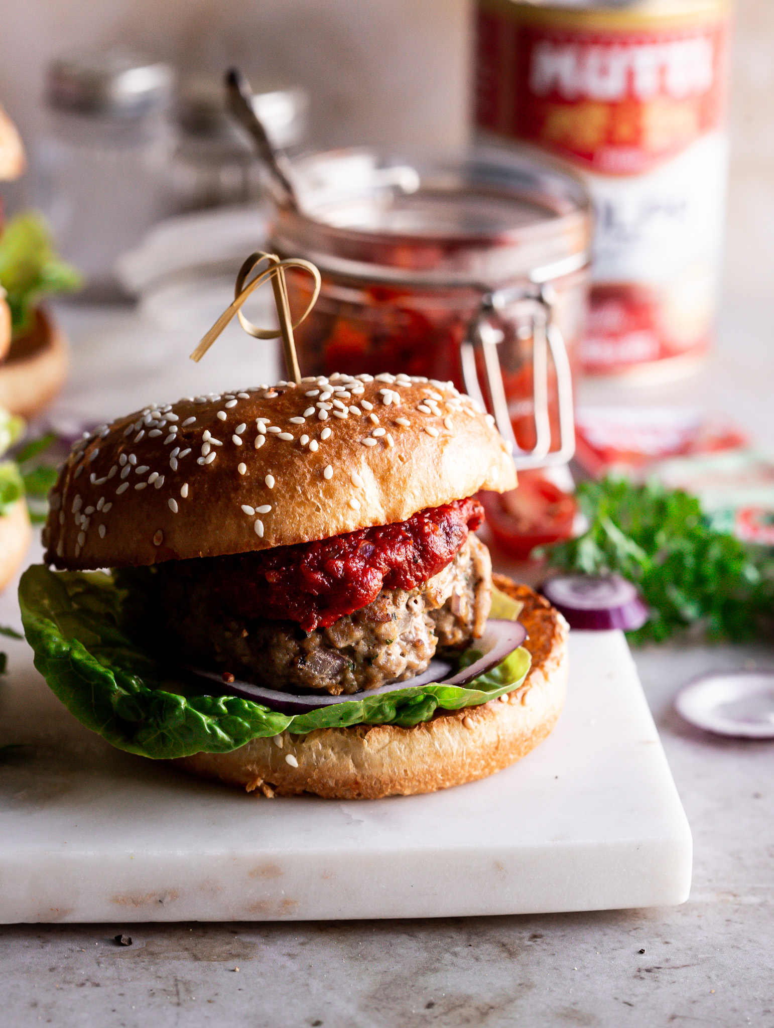 Tangy tomato jam served with homemade Sage Turkey burgers Tangy tomato jam served with homemade Sage Turkey burgers