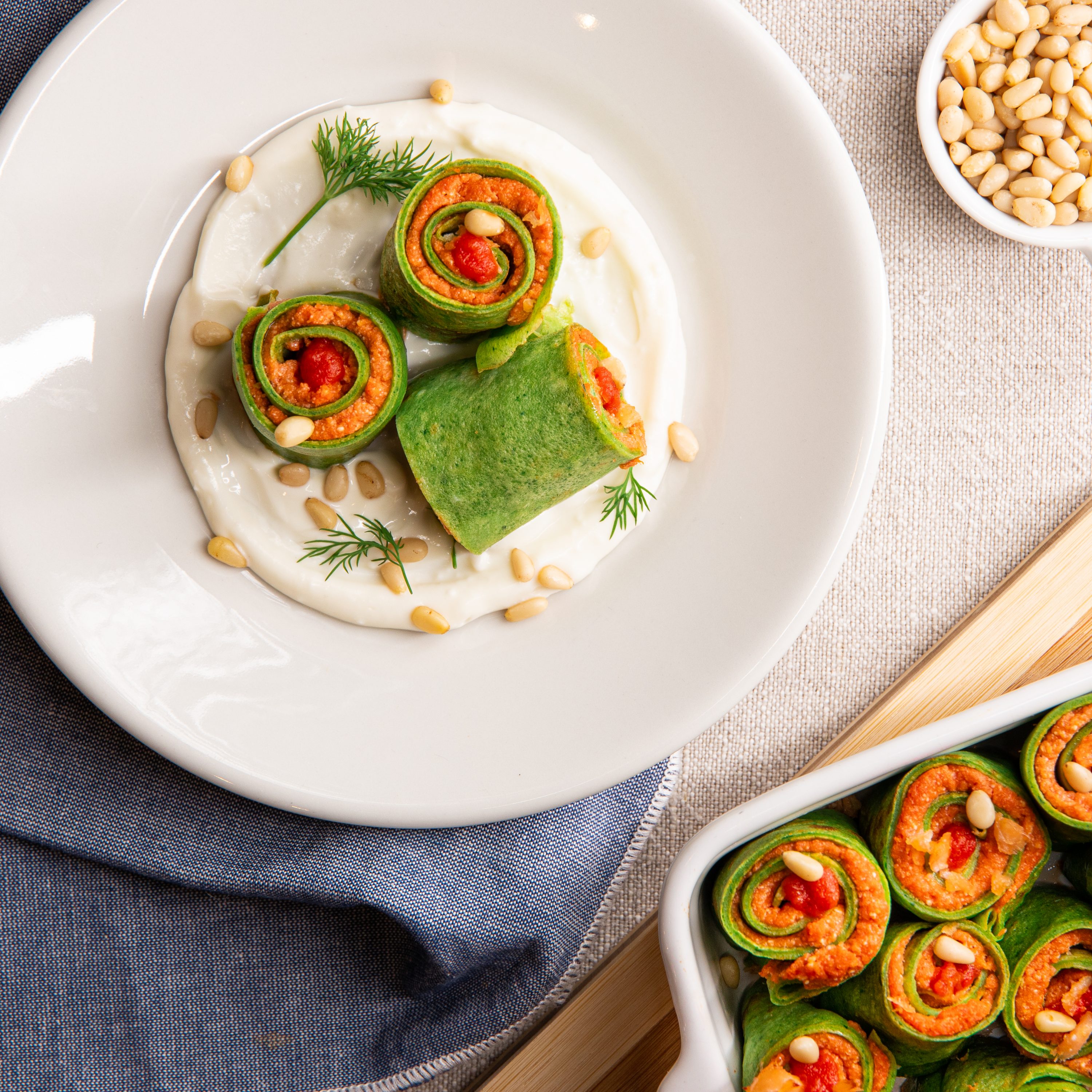 Green crepes with a salmon filling and toasted pine nuts Draft Green crepes with a salmon filling and toasted pine nuts Draft
