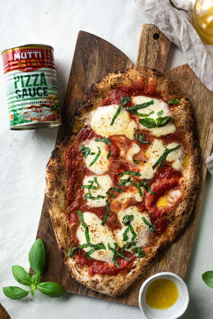 Grilled Flatbread Tomato Mozzarella Pizza with fresh basil and extra virgin olive oil Grilled Flatbread Tomato Mozzarella Pizza with fresh basil and extra virgin olive oil