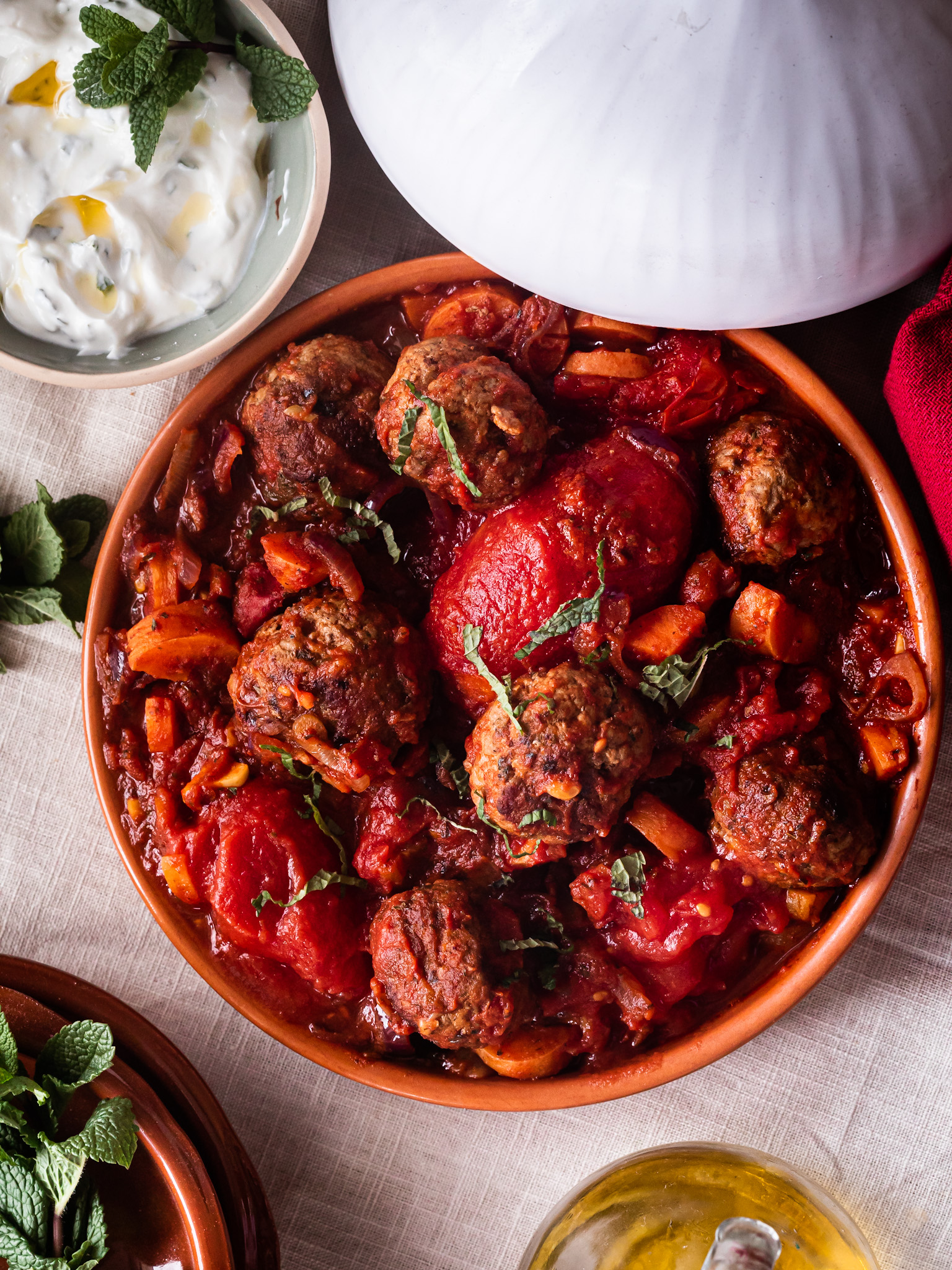 Tangy lamb meatball tagine with tomatoes, dates and apricots Tangy lamb meatball tagine with tomatoes, dates and apricots