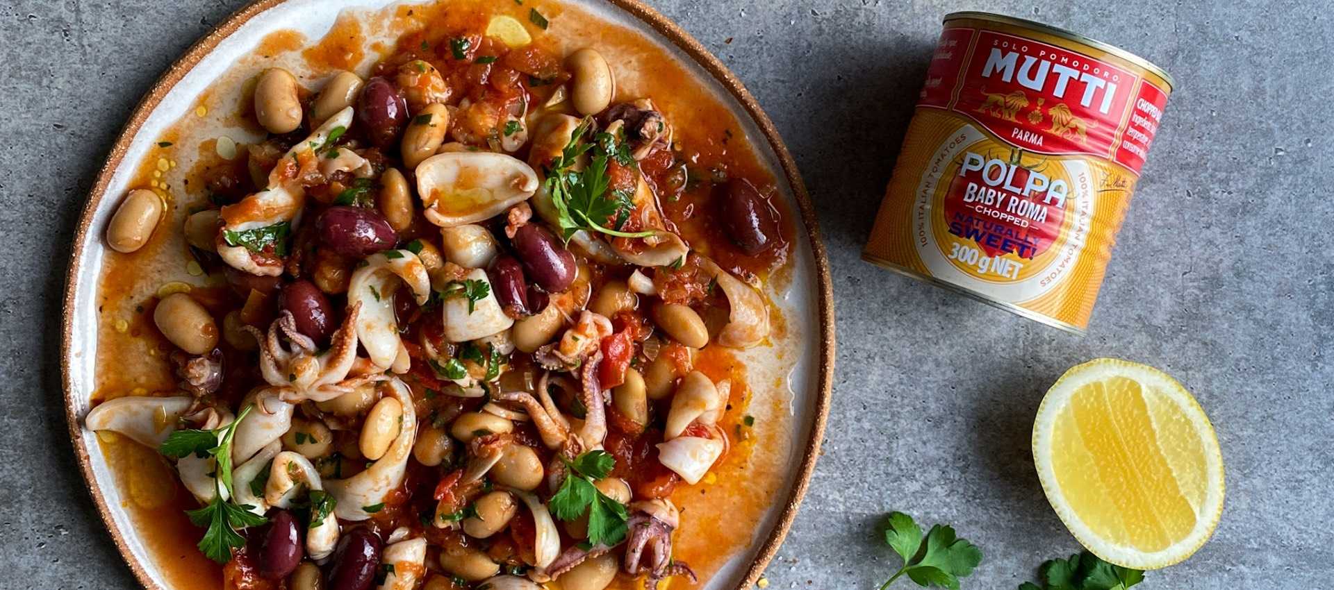 Braised Squid with Polpa Baby Roma Tomatoes, Olives & Butter Beans Braised Squid with Polpa Baby Roma Tomatoes, Olives & Butter Beans